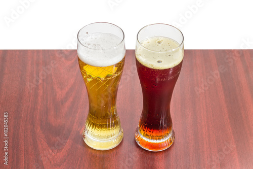 Two beer glasses with lager beer and dark beer photo