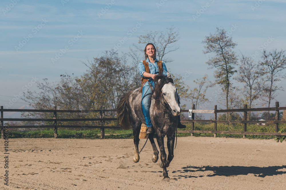 Pretty girl riding her grey horse Pretty girl riding her grey horse
