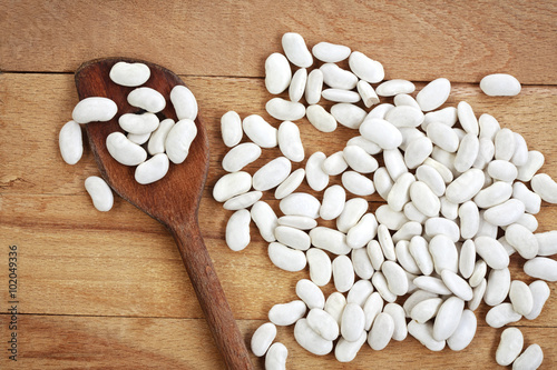 White beans on a wooden board