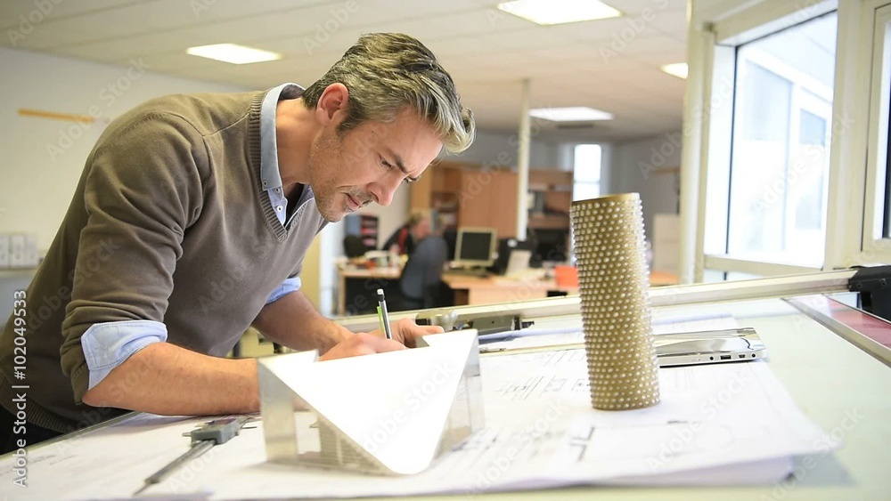 Industrial designer working on project in office