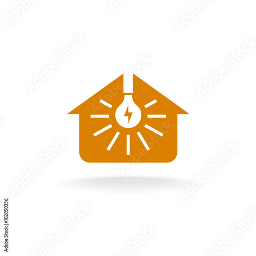 Light bulb with rays inside of a house silhouette logo. Home lighting concept.