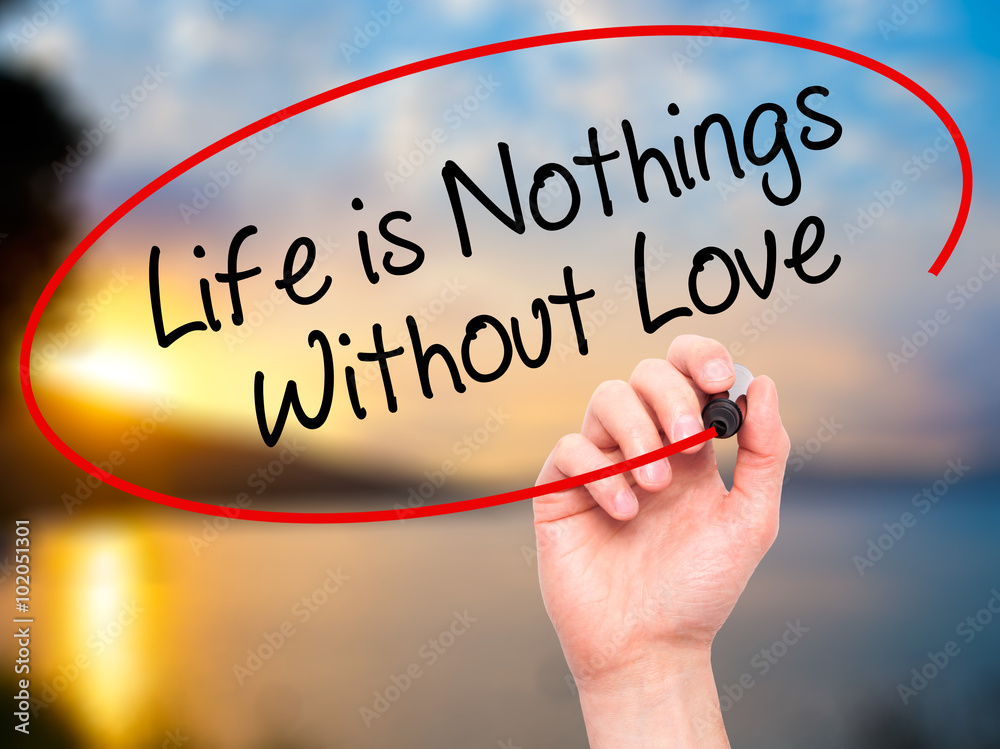 Man Hand writing Life is Nothings Without Love with black marker Man Hand writing Life is Nothings Without Love with black marker