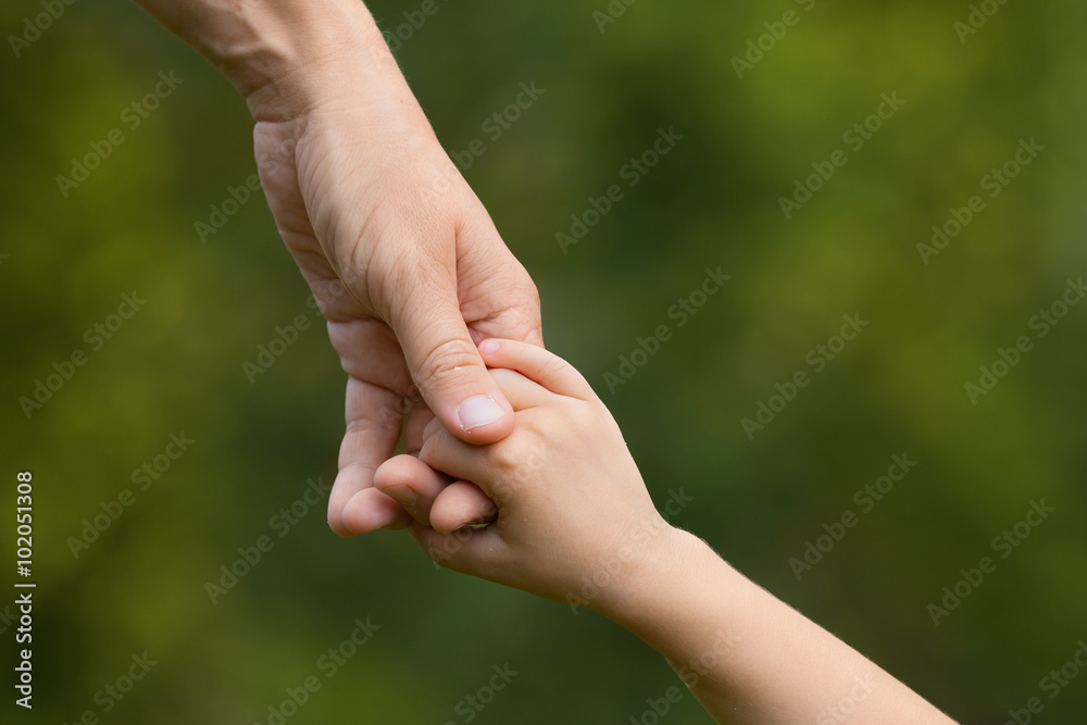 mother holding a hand of child mother holding a hand of child