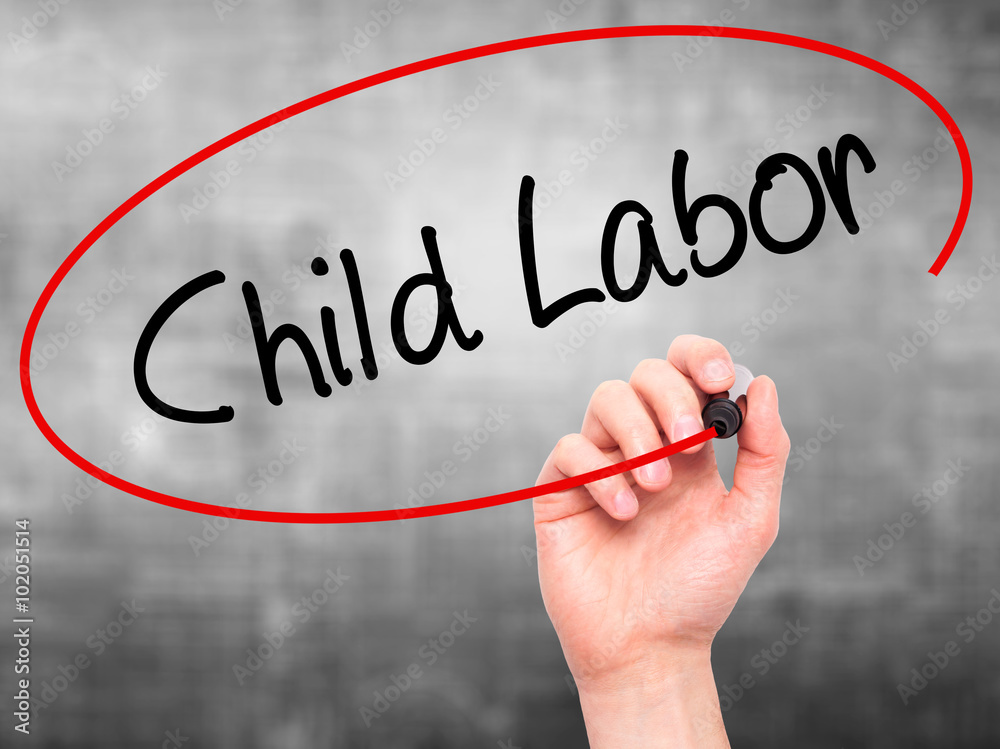 Man Hand writing Child Labor with black marker on visual screen Man Hand writing Child Labor with black marker on visual screen