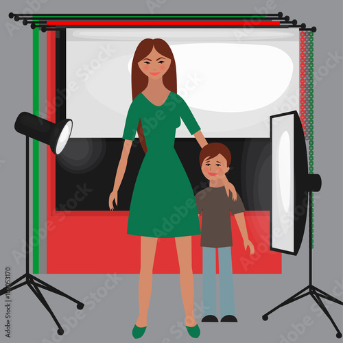 Set of photo studio equipment, paper photo background, light soft flat, flash, reflector, softbox, professional photographic technology. Family photoshoot with kid