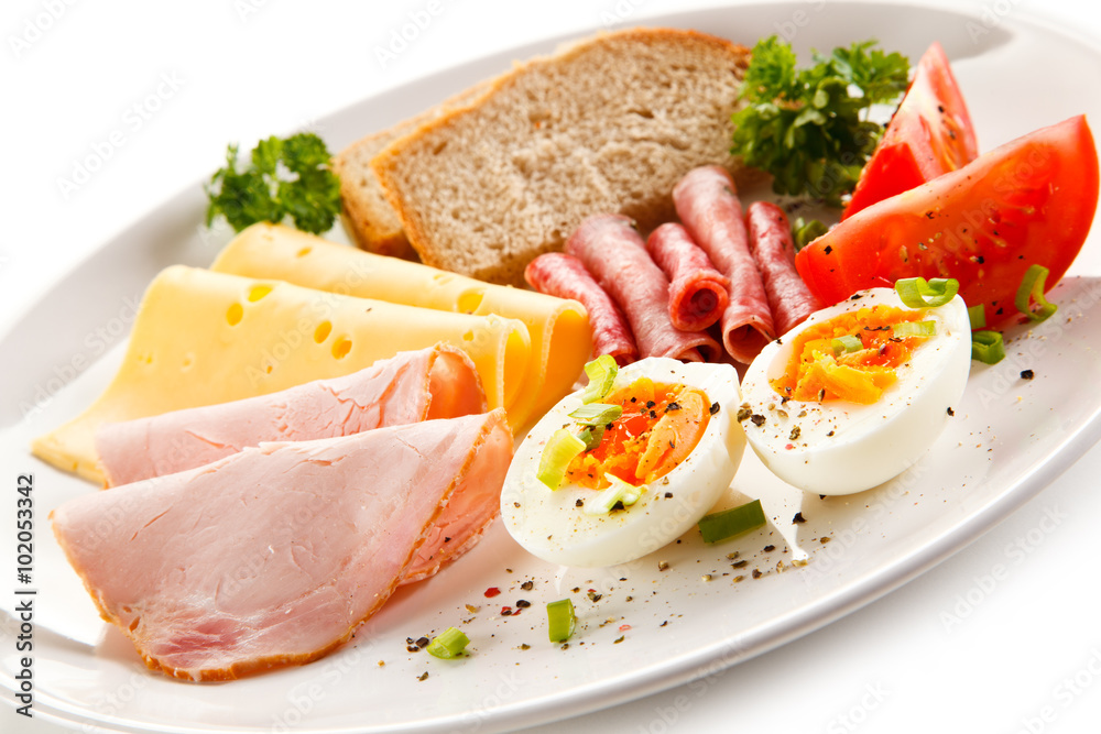 Breakfast - boiled egg, ham, cheese and vegetables Breakfast - boiled egg, ham, cheese and vegetables