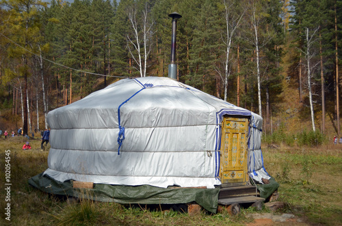 Nomadic yurt for tourists on hiking trail camp in autumn