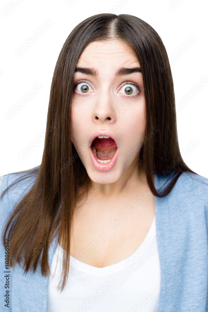 Close-up portrait of surprised beautiful woman in amazement and open-mouthed. Over white background. Close-up portrait of surprised beautiful woman in amazement and open-mouthed. Over white background.