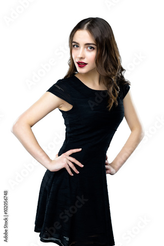 Beautiful young woman wearing black dress on white background