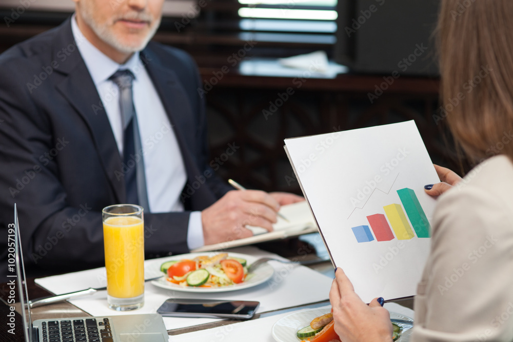 Experienced two managers have a dinner in restaurant Experienced two managers have a dinner in restaurant