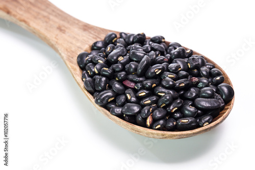 black beans in wooden spoon