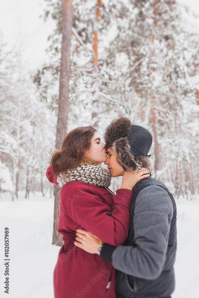 Happy Young Couple in Winter Park having fun.Family Outdoors. love, valentine day