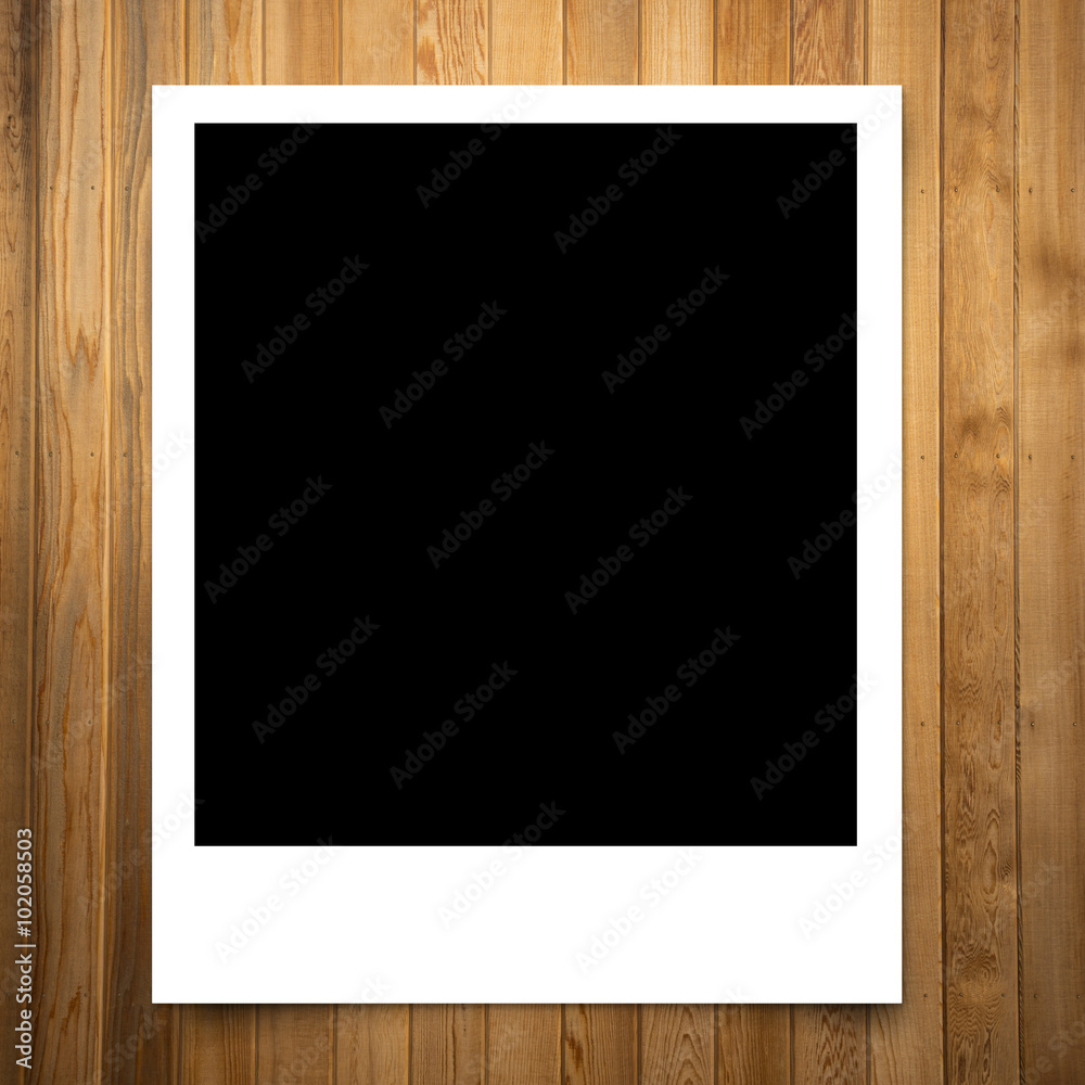 blank photo frame on brown wood plank background blank photo frame on brown wood plank background