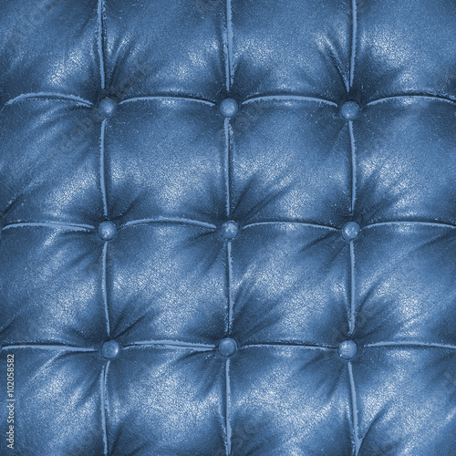 Old vintage blue leather chair close up detail