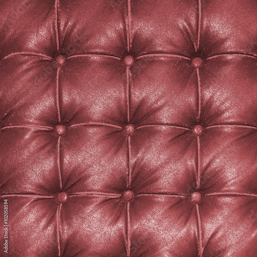 Old vintage red leather chair close up detail