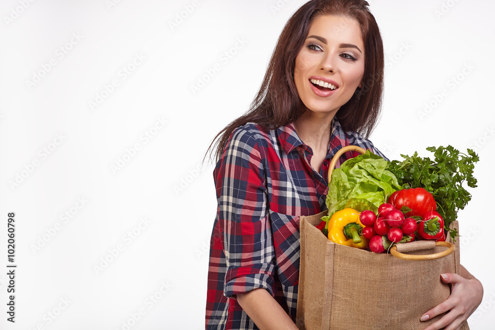 woman with groceries shopping bag full of healthy vegetables smi woman with groceries shopping bag full of healthy vegetables smi