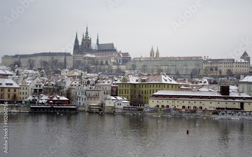 Prague castle with snow and grey sky