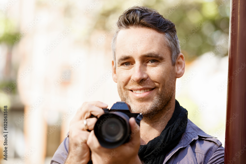 Male photographer taking picture