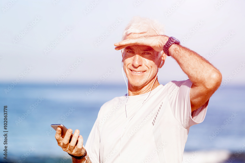Naklejka premium Sports and music. man getting ready for jogging