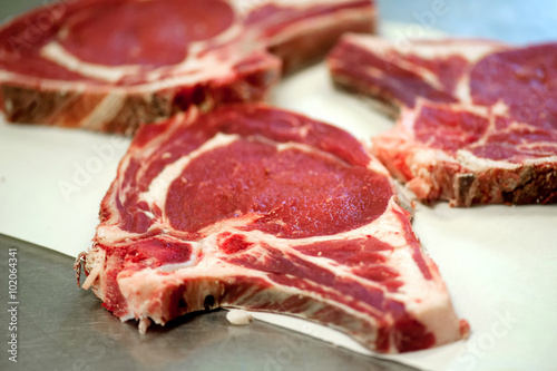 Raw rib eye steak in a butchery