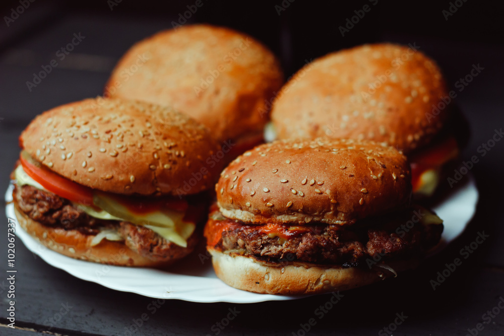 Beautiful Fresh burger closeup on wooden table