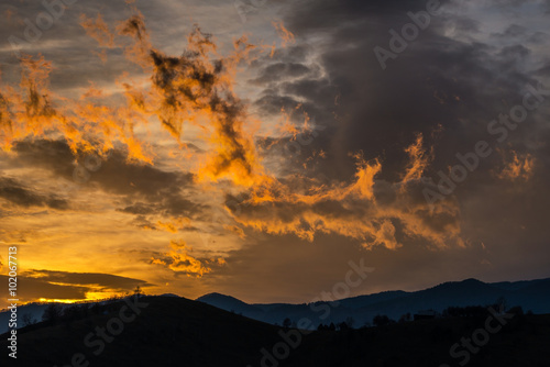 Autumn scenery in remote rural area in Transylvania and dramatic cloudy sky