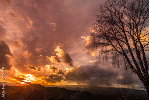 Autumn scenery in remote rural area in Transylvania and dramatic cloudy sky