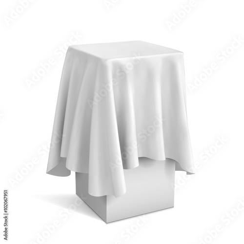 Presentation pedestal covered with a white cloth