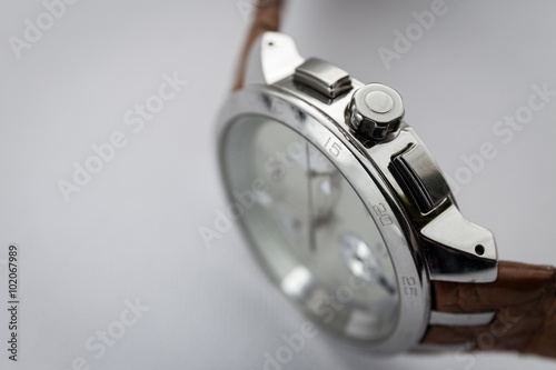 Man watches on white blurry background, closeup