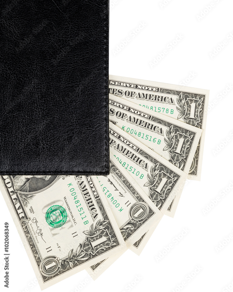 Part of the office notebook and dollar banknotes Part of the office notebook and dollar banknotes