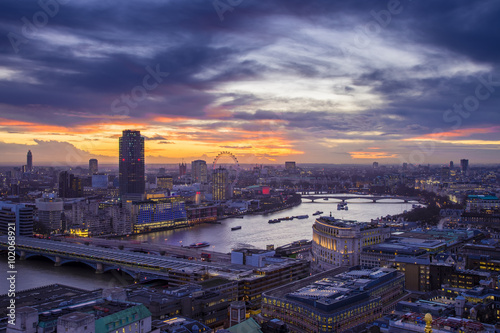 London, Engladn - Skyline of central London with famous landmarks, River Thames, skyscrapers and Blackfriars Bridge at sunset