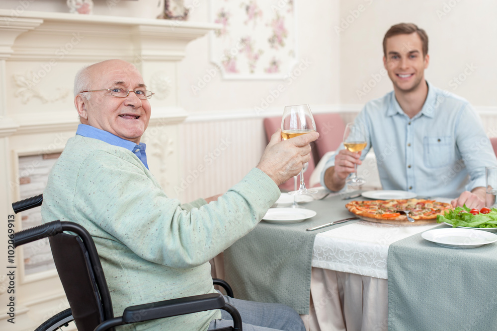 Two men have a family diner in cafe Two men have a family diner in cafe