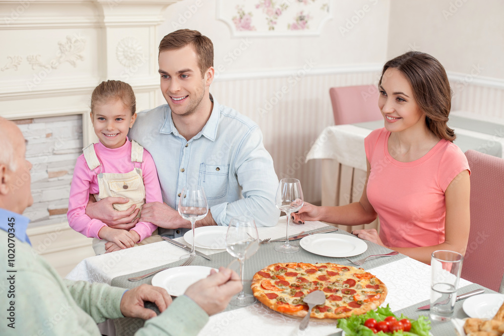 Mature man is celebrating his birthday with relatives Mature man is celebrating his birthday with relatives