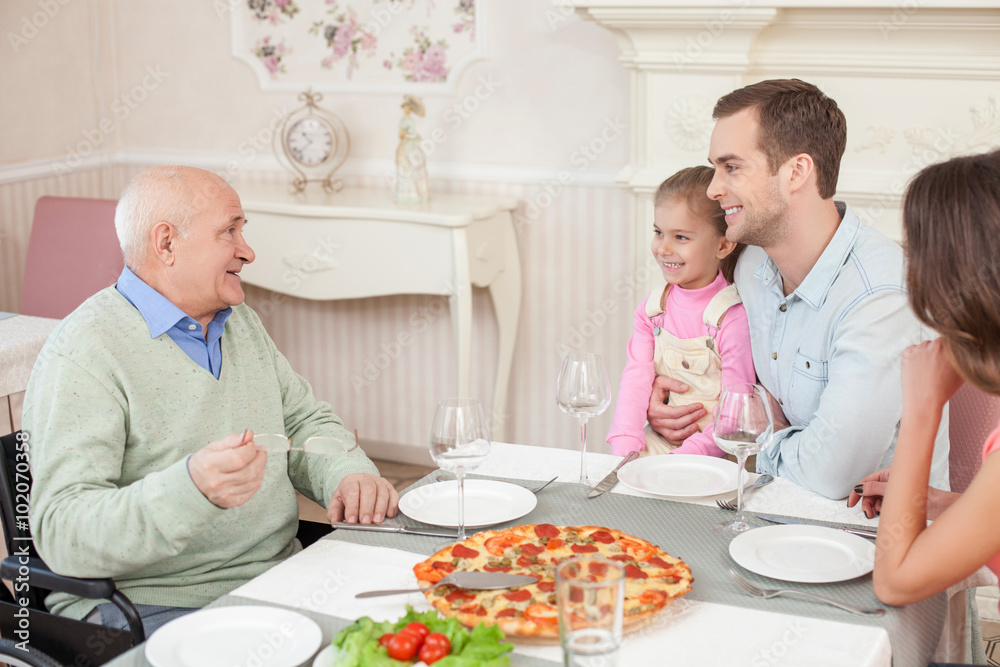 Pretty friendly family is dining in cafe Pretty friendly family is dining in cafe