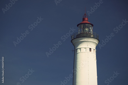 Lynvig Lighthouse against blue sky at the Danish North Sea coast, vintage style, Lynvig Fyr, Noerre Lyngvig, Jutland, Denmark, Europe 