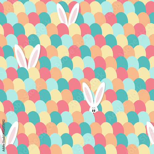 White bunny with long ears hiding and peeping out behind colorful Easter eggs. Seamless pattern. For greeting cards, fabric, backgrounds, children decoration	
