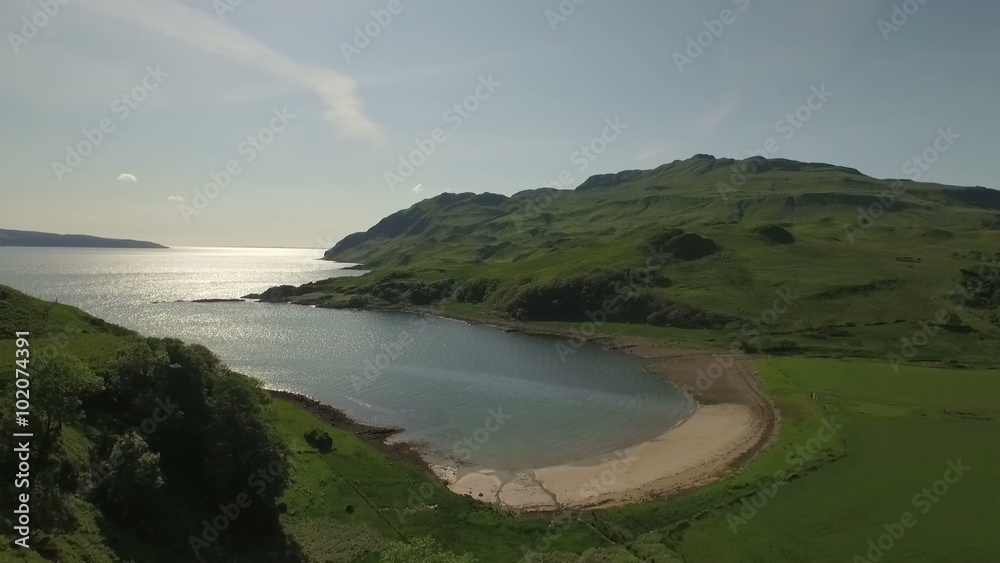 Aerial shot along the beach on the coastline during a sunset at Ardnamurchan, Scotland
Aerial shot along the beach on the coastline during a sunset at Ardnamurchan, Scotland