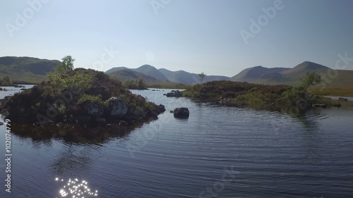 Stunning drone shot in Scotland of Lochan na h-Achlaise by Rannoch Moor on the A83 towards Glen Coe
 photo