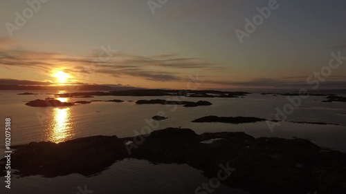 Aerial shot of the coast line on the west coast of Scotland during sunsey near Arisaig with Rum and Eigg in the background
 photo