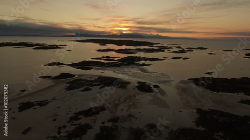 Aerial shot of the coast line on the west coast of Scotland during sunsey near Arisaig with Rum and Eigg in the background
 photo