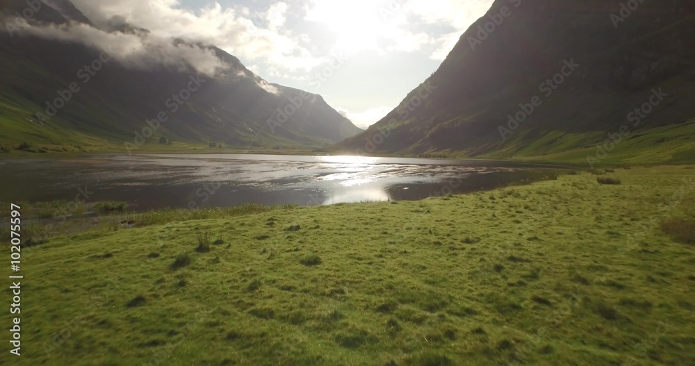 Beautiful aerial shot of Glencoe and Glen Etive in the Scottish highlands on a beautiful sunny day 
