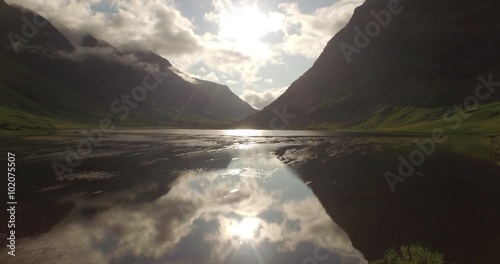 Beautiful aerial shot of Glencoe and Glen Etive in the Scottish highlands on a beautiful sunny day 
