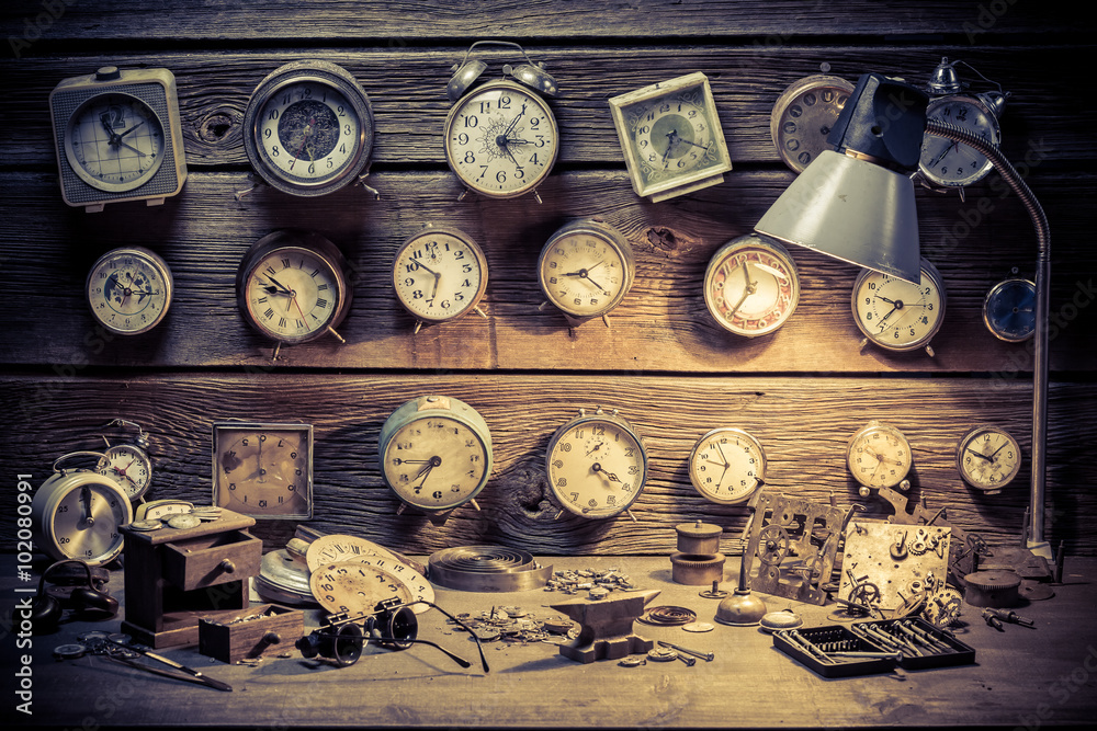 Watchmaker's workshop with clocks to repair Watchmaker's workshop with clocks to repair