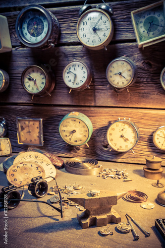 Old watchmaker's workshop with clocks to repair