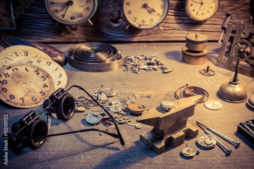 Old watchmaker's workshop with parts of clocks