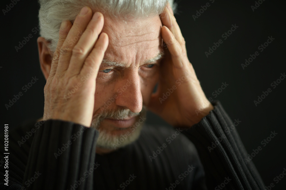 Fototapeta premium Sad senior man at home