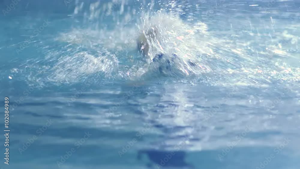 Aerial Overhead Shot of Professional Swimmer Performing Front Crawl during Training in Swimming Pool Aerial Overhead Shot of Professional Swimmer Performing Front Crawl during Training in Swimming Pool