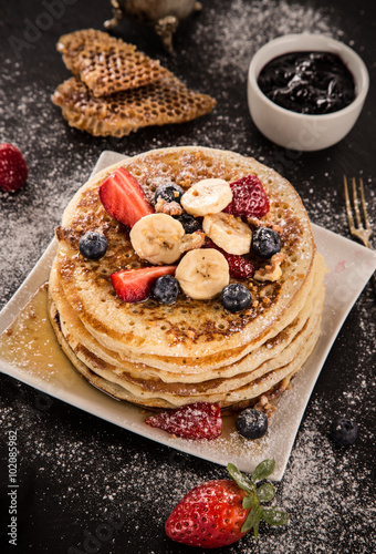 Stack of pancakes with fres...
