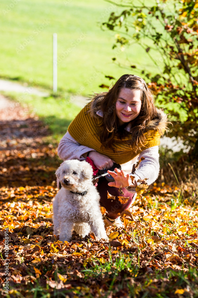 Girl with a poodle in forest Girl with a poodle in forest