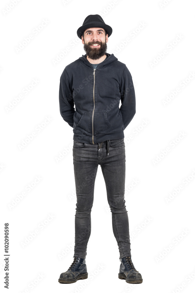 Happy smiling punker with smiley pierce wearing black fedora hat. Full body length portrait isolated over white studio background. Happy smiling punker with smiley pierce wearing black fedora hat. Full body length portrait isolated over white studio background.